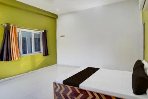 Katil atau katil-katil dalam bilik di Hotel O Raj Palace