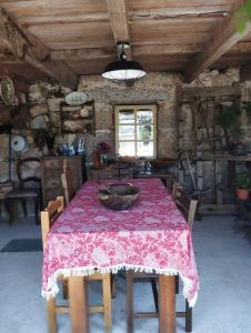 a dining room with a table with a bowl on it at 3HOUSE Sol na Eira in Rebordosa