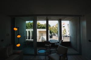 a living room with a view of a balcony at Apartment Oro in Braga +15 photos
