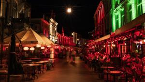 a group of people walking down a street at night at Villa Valkenburg in Valkenburg