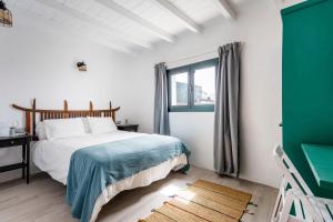 Ένα ή περισσότερα κρεβάτια σε δωμάτιο στο NEW Finca Panorama - Stunning 5 Bedroom with pool +30 φωτογραφίες