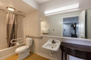 a bathroom with a white toilet and a sink at Motel 6 Culpeper, VA in Culpeper +44 photos