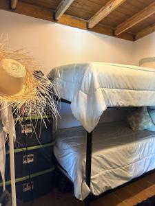 two bunk beds in the corner of a room at Lady Aura Casitas in Cabo Rojo, Puerto Rico in Cabo Rojo