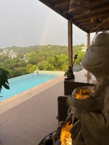a view of a swimming pool from a resort at Lady Aura Casitas in Cabo Rojo, Puerto Rico in Cabo Rojo +83 photos