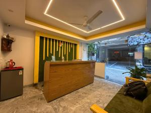 a lobby with a reception desk in a room at Yellow Leaf in Rishīkesh