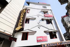 a building with a sign on the side of it at Hotel O Surya in Ludhiana +25 photos