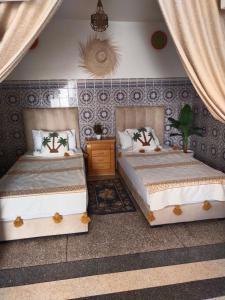 Una cama o camas en una habitación de Nest Surf Housse Anza