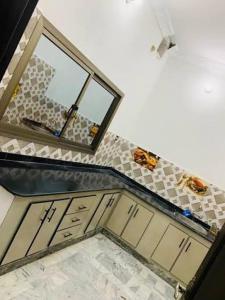 a view of a bathroom with a mirror and a sink at Ibrahim flats Mardan in Mardan