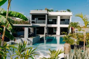 an image of a house with a swimming pool at Baobab Village in Watamu