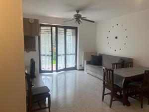 a living room with a couch and a table at Casa LORY in Brescia