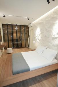 Ένα ή περισσότερα κρεβάτια σε δωμάτιο στο Lumino apartment