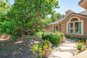 a house with a tree in the yard at Tranquil Quiet Mountain Home w Private Garden in Chino Hills