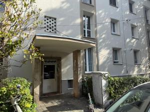 an entrance to a white building with a door at Groundfloor Rahmaninov in Bucharest