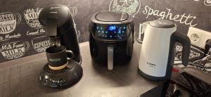 a coffeemaker and a coffee maker on a counter at BayVista, die Bayerwald Lodge in Lam +26 photos