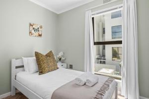 Ένα ή περισσότερα κρεβάτια σε δωμάτιο στο 17 Megan's Place by Host Agents