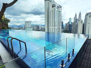a large swimming pool on top of a city at Majestic Residence Suites KLCC in Kuala Lumpur