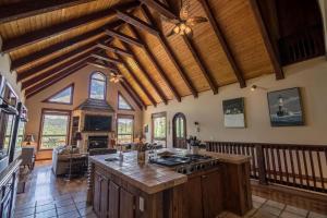 a kitchen with a stove top oven in a room at Stoneledge Manor in Banner Elk