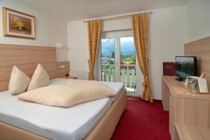 Ein Bett oder Betten in einem Zimmer der Unterkunft Hotel-Pension Melcher