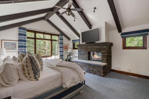 a bedroom with a bed and a fireplace at RMR: Granite Ridge Lodge 3209 in Teton Village in Teton Village