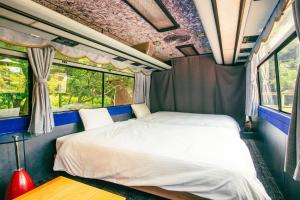 a bed in the back of a train room at Yura Green - Vacation STAY 65841v in Yura