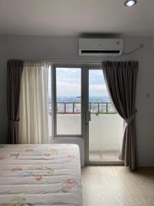 a bedroom with a bed and a large window at Gumir Haven in Polonia Airport +10 photos