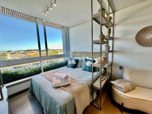 Postel nebo postele na pokoji v ubytování Lofts 415 e 417 Completos em Livin Home Resort ao lado do Ramblas + 54 fotografií