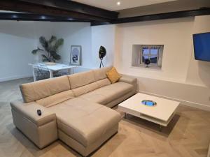 a living room with a couch and a table at Liverpool Penthouse - Sleeps 8 - City Centre in Liverpool