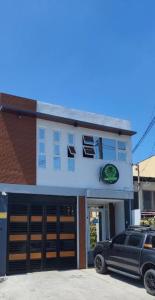a car parked in front of a building at Tony's City Centered Budget Room in San Fernando