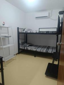 a room with two bunk beds in a room at Tony's City Centered Budget Room in San Fernando