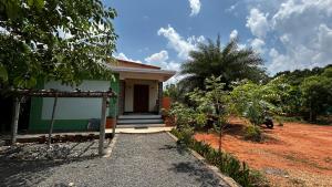 a small house with a pathway leading to it at Pk Villa in Auroville