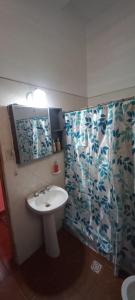 a bathroom with a sink and a shower at Alojamiento la posta in Perico