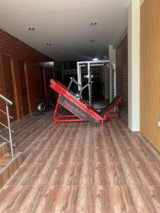 a gym with a red treadmill in a room at Hotel Huancayo - El Toro Wanka in San Antonio