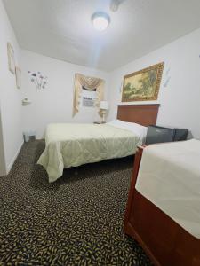 Postel nebo postele na pokoji v ubytování Mana's guest suite + 4 fotografie