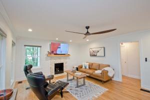 a living room with a couch and a fireplace at Medical District 3bd 3bth Bungalow in Decatur