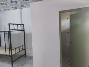 Μία ή περισσότερες κουκέτες σε δωμάτιο στο MG Rooms