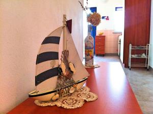 a wooden model of a boat sitting on a table at Apartments Luna in Lovran