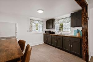 a kitchen with black cabinets and a counter top at Blue Ox in Pensacola