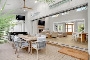 a dining room with a table and chairs at Creekside - Custom Luxury in Bay Creek Resort! in Cape Charles