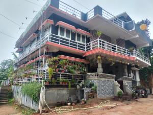 a building with a lot of plants on it at Coorg veena villa in Madikeri