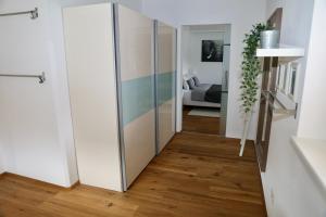 a hallway with a sliding door in a living room at Ferienwohnung Mieminger Plateau in Mieming