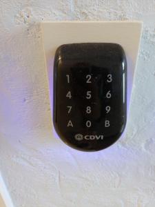 a black remote control attached to a wall at Albert 2 - V2 in Mechelen