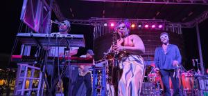a group of men standing on a stage at Steps From Balloon Fiesta Park Outdoor Retreat in Albuquerque