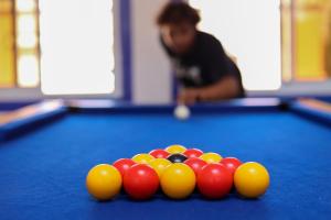 a pool table with a bunch of balls on it at Blue Rina Hostel in Agadir
