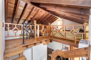 a wooden staircase in a house with wooden ceilings at Apartamentos - PinkSparrow - in Granada