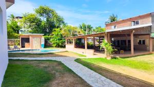 an image of a house with a swimming pool at Gipsy Ranch Rooms in Cabarete
