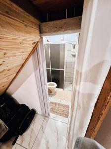 a small bathroom with a toilet in a room at Pousada Canto da Sereia in Ilha do Mel