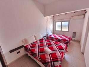 Ένα ή περισσότερα κρεβάτια σε δωμάτιο στο Aisha Alojamiento +12 φωτογραφίες