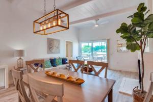 a dining room and living room with a table and chairs at Jetty View 1 in San Diego +12 photos