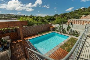 a swimming pool on top of a building at Lovemore Retreat - Port Elizabeth in Gqeberha