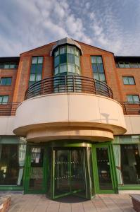 a building with a balcony on top of it at Sandman Signature Sheffield Quays Hotel in Sheffield